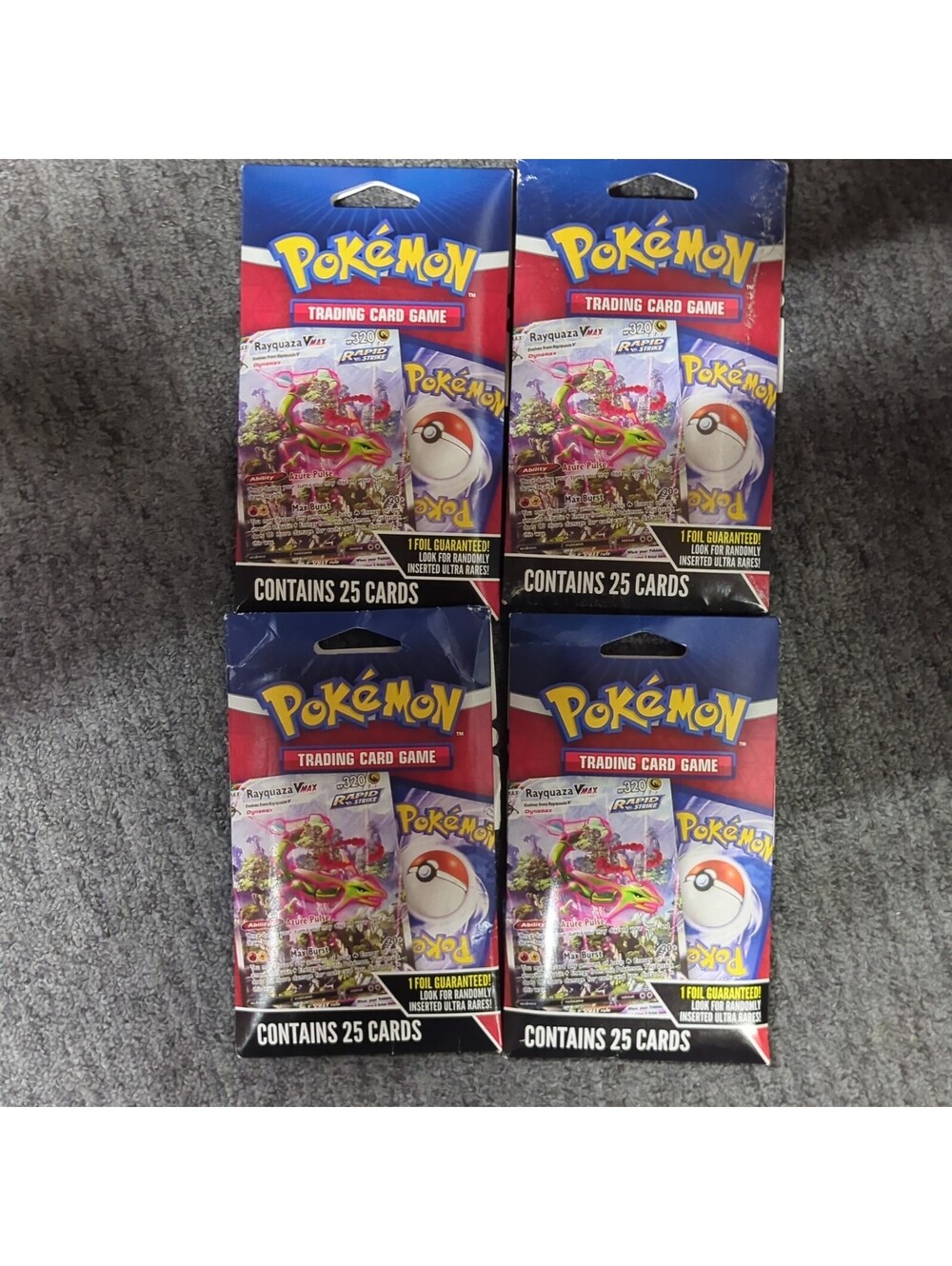 4 PACK of NEW Pokémon Trading Card Game Rapid Strike VMAX 25-Pack w/ 1 Foil